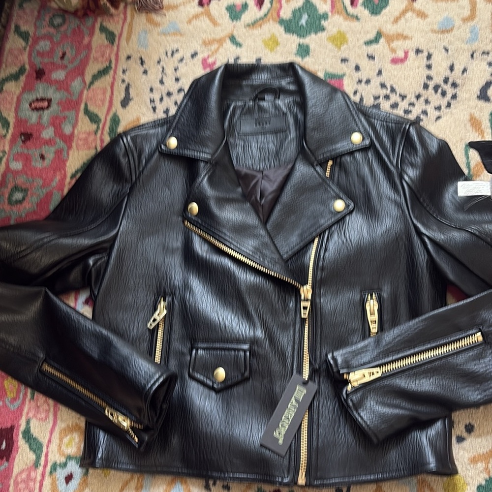 Beautiful faux leather jacket, new with tags. Timeless, classic wardrobe piece.